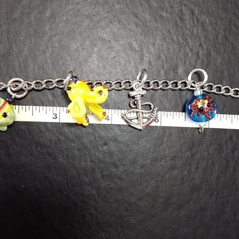 Silver tone Under The Sea charm bracelet up to 9